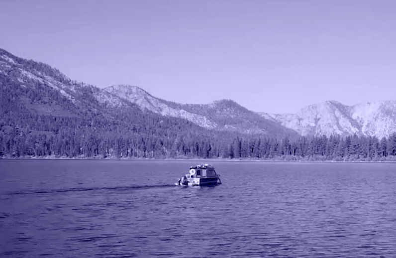 A small boat makes its way out into Lake Tahoe