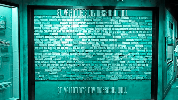 A brick wall with raised signage that reads "St. Valentine's Day Massacre Wall"
